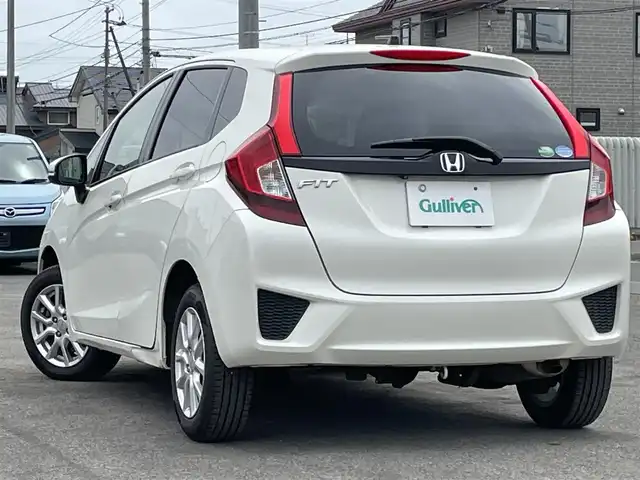 ホンダ フィット 13G Fパッケージ 道央・札幌 2013(平25)年 11.6万km プレミアムホワイトパール ４WD/ワンオーナー/純正ディーラーOPナビ/CD/DVD/BT/フルセグ/横滑り防止装置/バックカメラ/ETC/アイドリングストップ/ECONモード/ワイパーデアイサー/ステアリングリモコン/プッシュスタート/スマートキー/ハロゲンヘッドライト/ヘッドライトレベライザー/電動格納ミラー/ヒーテッドドアミラー/ウィンカーミラー/純正フロアマット/スペアキー/純正エンジンスターター
