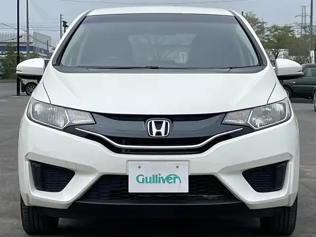 ホンダ フィット 13G Fパッケージ 道央・札幌 2013(平25)年 11.6万km プレミアムホワイトパール ４WD/ワンオーナー/純正ディーラーOPナビ/CD/DVD/BT/フルセグ/横滑り防止装置/バックカメラ/ETC/アイドリングストップ/ECONモード/ワイパーデアイサー/ステアリングリモコン/プッシュスタート/スマートキー/ハロゲンヘッドライト/ヘッドライトレベライザー/電動格納ミラー/ヒーテッドドアミラー/ウィンカーミラー/純正フロアマット/スペアキー/純正エンジンスターター