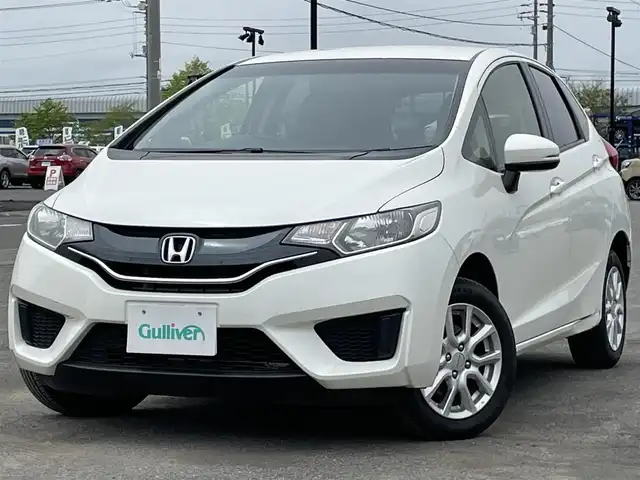 ホンダ フィット 13G Fパッケージ 道央・札幌 2013(平25)年 11.6万km プレミアムホワイトパール ４WD/ワンオーナー/純正ディーラーOPナビ/CD/DVD/BT/フルセグ/横滑り防止装置/バックカメラ/ETC/アイドリングストップ/ECONモード/ワイパーデアイサー/ステアリングリモコン/プッシュスタート/スマートキー/ハロゲンヘッドライト/ヘッドライトレベライザー/電動格納ミラー/ヒーテッドドアミラー/ウィンカーミラー/純正フロアマット/スペアキー/純正エンジンスターター