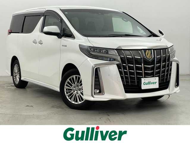 トヨタ アルファードハイブリット S タイプゴールド 群馬県 2021(令3)年 0.5万km ホワイトパールクリスタルシャイン 純正9インチディスプレイオーディオ/・AM/FM/USB/Bluetooth/Miracast/純正フリップダウンモニター/トヨタセーフティセンス/・プリクラッシュセーフティシステム/・レーントレーシングアシスト/・アダプティブハイビームシステム/・レーダークルーズコントロール(全車速追従機能付)/・ロードサインアシスト/バックカメラ/パワーバックドア/両側パワースライドドア/プッシュスタート/スマートキー
