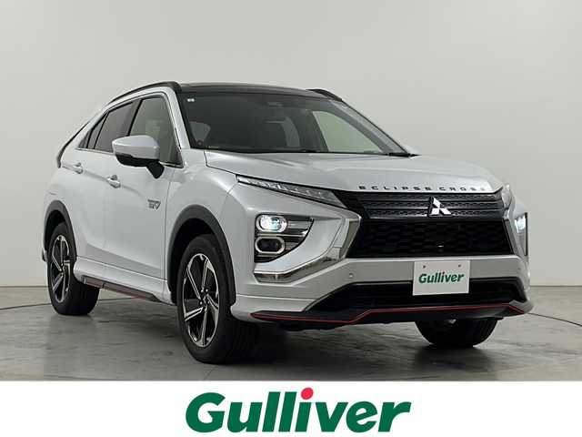 三菱 エクリプス クロス ＰＨＥＶ P 道央・札幌 2021(令3)年 3.1万km ホワイトダイヤモンド ・４WD/PHEV/・電動パノラマサンルーフ/・スポイラーパッケージOP/・スタイリングパッケージOP/・衝突被害軽減ブレーキシステム/・レーダークルーズコントロール/・オートマチックハイビーム[AHB]/・純正ディスプレイオーディオ/・Bluetooth.APPS.フルセグ/・全方位カメラ/バックカメラ/・レザーシート/パワーシート/・全席シートヒーター/・AC100V1500W/・コーナーセンサー/・パドルシフト/ステアリングヒーター/・充電コード