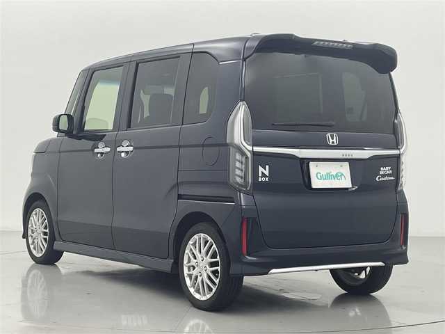 ホンダ Ｎ ＢＯＸ カスタム L ターボ 熊本県 2021(令3)年 1.3万km ミッドナイトブルービームM 純正8インチナビVXV-217NBi（ＡｐｐｌＣａｒＰｌａｙ・ＢＴ・フルセグ・ＵＳＢ）/純正前後ドライブレコーダー　/バックカメラ　/純正ビルトインＥＴＣ　/後ろのみコーナーセンサー　/両側パワースライドドア　/ホンダセンシング　/・衝突軽減ブレーキ/・歩行者事故低減ステアリング/・路外逸脱制御機能/・先行車発進お知らせ機能/・車線維持支援システム/・アダブティブクルーズコントロール/・誤発進制御機能/・後方誤発進抑制機能/横滑り防止/アイドリングストップ/前席シートヒーター/純正フロアマット/純正１５インチAW/オートライト/LEDヘッドライト/フォグライト/スマートキー/プッシュスタート/スペアキー1本