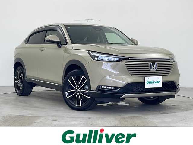 ホンダ ヴェゼル ハイブリッド e:HEV Z 秋田県 2024(令6)年 1万km サンドカーキパール ４WD/純正ディスプレイオーディオ /バックカメラ　/純正AW /LEDヘッドライト　/ハーフレザーシート /ステアリングヒーター　/クルーズコントロール/スマートキー/ステアリングリモコン　/パドルシフト　/前席シートヒーター　/ETC /前後ドライブレコーダー/ヒルディセントコントロール/ホンダECON/自動パーキングブレーキ/ブレーキホールド/革巻きステアリング/電格ミラー/オートライト/クリアランスソナー /フロントワイパーデアイサー /横滑り防止装置/コーナーセンサー /フォグライト /純正フロアマット/ハーフレザーシート /USBポート/ウィンカーミラー /サイドバイザー /純正AW