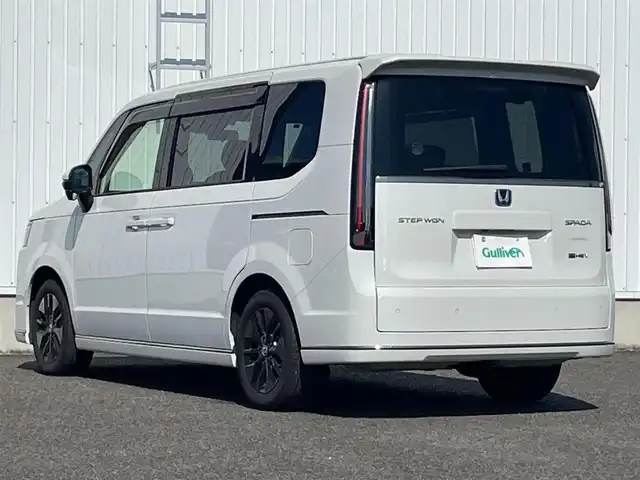 ホンダ ステップワゴン スパーダ eHEV 熊本県 2024(令6)年 0.5万km プラチナホワイトパール 純正ナビ/・BT/USB/SD/AM/FM/・フルセグTV/ホンダセンシング/バックカメラ/ビルトインETC/アダプティブクルーズコントロール/両側パワースライドドア/前後ドラレコ/D/Nシートヒーター/プッシュスタート/・スマートキー/純正AW/革調シートカバー/電動格納ミラー/・ミラーウィンカー