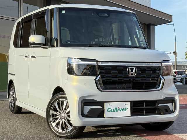 ホンダ Ｎ ＢＯＸ カスタム 香川県 2024(令6)年 1.4万km プレミアムサンライトホワイトパール ワンオーナー/純正9インチコネクトナビ/【フルセグ/CD/DVD/BT】/バック/フロントカメラ/ホンダセンシング/レーダークルーズコントロール/両側パワースライドドア/LEDヘッドライト/衝突被害軽減システム/前後コーナーセンサー/レーンキープアシスト/オーバーヘッドコンソール/革調シートカバー/シートバックテーブル/スマートキー/ビルトインETCウィンカーミラー
