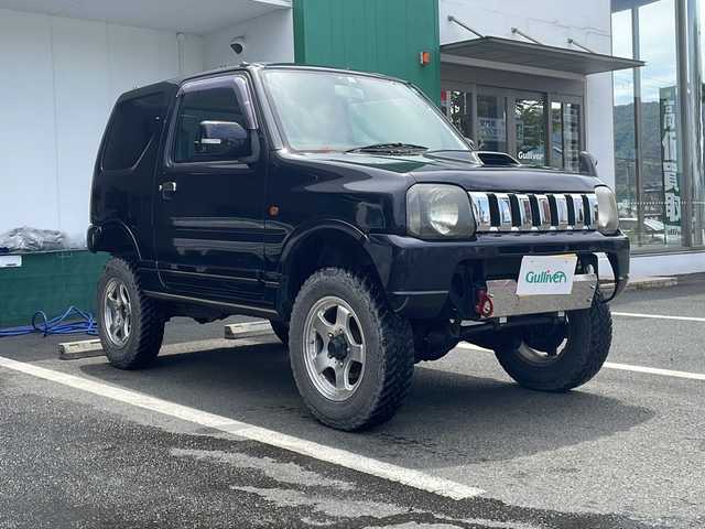 スズキ ジムニー FISフリースタイルワールドC LTD 京都府 2004(平16)年 10.5万km ブルーイッシュブラックパール3 ４WD/ターボ/5速マニュアル/社外HDDナビ/リフトアップ/社外マフラー/ETC/リモコンキー/社外16インチアルミ/革巻きステアリング
