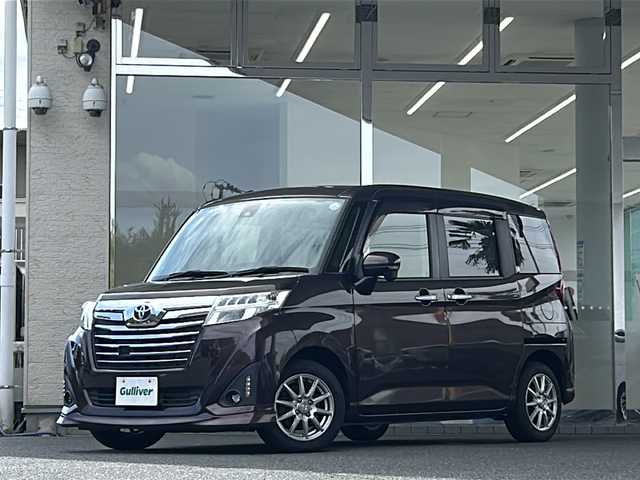 トヨタ ルーミー カスタムG－T 福島県 2016(平28)年 5.2万km プラムブラウンパールクリスタルシャイン 登録時走行距離：51642km/純正SDナビ/（フルセグ/BT接続/HDMI/USB/CD/DVD/AM/FM）/ETC/クルーズコントロール/両側パワースライドドア/衝突被害軽減ブレーキ/PUSHスタート/横滑り防止装置/アイドリングストップ/オートライト/HIDヘッドライト/シートヒーター/社外AW/純正フロアマット/コーナーセンサー/ステアリングスイッチ/保証書/取扱説明書/スペアキー