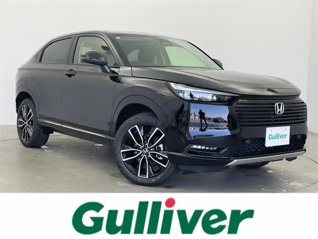 ホンダ ヴェゼル ハイブリッド e:HEV Z 富山県 2025(令7)年 0.1千km クリスタルブラックパール 登録済未使用車/9インチHonda CONNECTディスプレイ/（AM/FM/USB/BT/AppleCarPlay/AndroidAuto）/フルセグTV/バックカメラ/アダプティブクルーズコントロール/衝突被害軽減ブレーキ/レーンキープアシスト/オートマチックハイビーム/LEDヘッドライト/クリアランスソナー/ブラインドスポットモニター/電動リアゲート/ハーフレザーシート/前席シートヒーター/ビルトインETC2.0/置くだけ充電/スマートキー×２/プッシュスタート/パドルシフト/取扱説明書/保証書