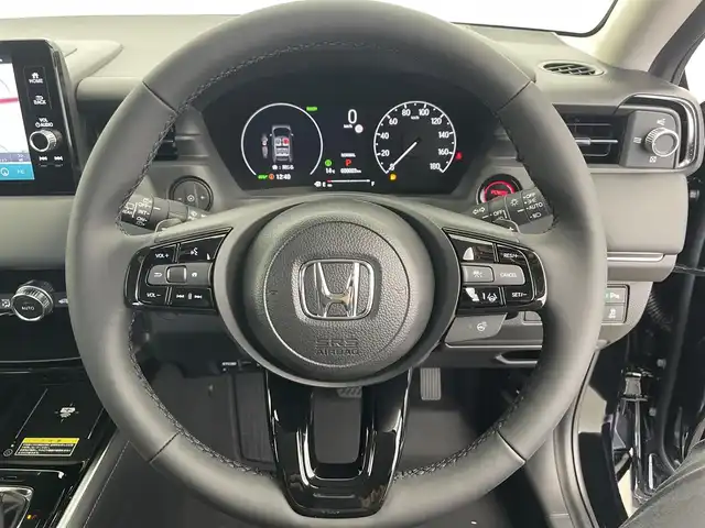 ホンダ ヴェゼル ハイブリッド e:HEV Z 富山県 2025(令7)年 0.1千km クリスタルブラックパール 登録済未使用車/9インチHonda CONNECTディスプレイ/（AM/FM/USB/BT/AppleCarPlay/AndroidAuto）/フルセグTV/バックカメラ/アダプティブクルーズコントロール/衝突被害軽減ブレーキ/レーンキープアシスト/オートマチックハイビーム/LEDヘッドライト/クリアランスソナー/ブラインドスポットモニター/電動リアゲート/ハーフレザーシート/前席シートヒーター/ビルトインETC2.0/置くだけ充電/スマートキー×２/プッシュスタート/パドルシフト/取扱説明書/保証書