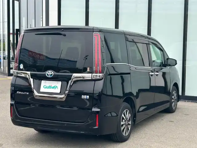 トヨタ エスクァイア ハイブリッド Gi プレミアムパッケージ ブラックテーラード 大阪府 2021(令3)年 1.4万km ブラック 純正１０インチナビ/  フルセグTV/CD/DVD/Bluetooth/USB/衝突軽減/バックモニター/１２インチ後席モニター/前席シートヒーター/両側パワースライドドア/クルーズコントロール/ドライブレコーダー/コーナーセンサー/純正15インチアルミホイール/純正フロアマット/100V電源/スマートキー/ワンオーナー/ＥＴＣ/ＬＥＤライト