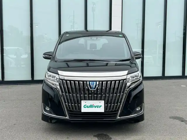 トヨタ エスクァイア ハイブリッド Gi プレミアムパッケージ ブラックテーラード 大阪府 2021(令3)年 1.4万km ブラック 純正１０インチナビ/  フルセグTV/CD/DVD/Bluetooth/USB/衝突軽減/バックモニター/１２インチ後席モニター/前席シートヒーター/両側パワースライドドア/クルーズコントロール/ドライブレコーダー/コーナーセンサー/純正15インチアルミホイール/純正フロアマット/100V電源/スマートキー/ワンオーナー/ＥＴＣ/ＬＥＤライト