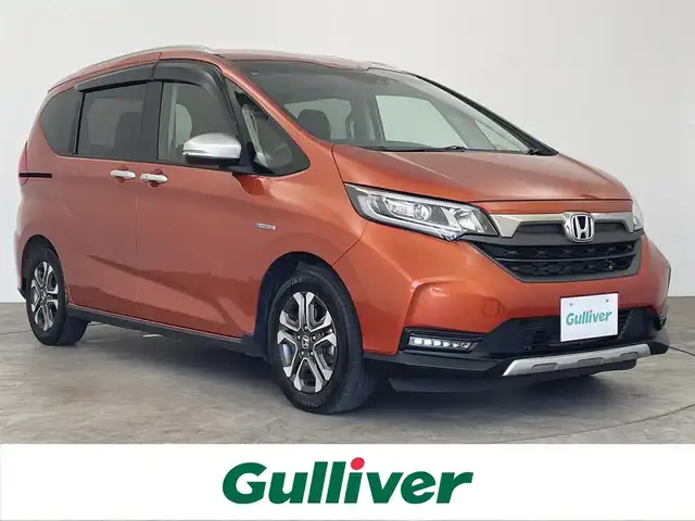 ホンダ フリード ハイブリット クロスター ホンダセンシング 大分県 2020(令2)年 7.5万km プレミアムクリスタルオレンジM 純正ナビ/フルセグ/DVD/Bluetooth/バックカメラ/両側パワスラ/ホンダセンシング/ビルトインETC/オートLEDライト/合皮ハーフレザー/スマートキー/保証書