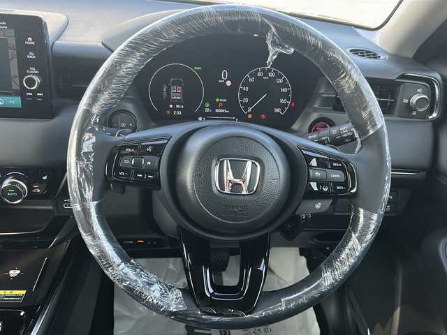 ホンダ ヴェゼル ハイブリッド e:HEV Z 三重県 2025(令7)年 0.1千km クリスタルブラックパール 登録済未使用車/純正ナビ/アップルカープレイ/アンドロイドオート/BSM/バックカメラ/追従クルーズコントロール/シートヒーター/電動リアゲート/純正ビルトインETC2.0/ワイヤレス充電/ステアリングヒーター/ステアリングスイッチ/レーンキープアシスト/衝突軽減ブレーキ/電子パーキング/LEDヘッドライト/禁煙車
