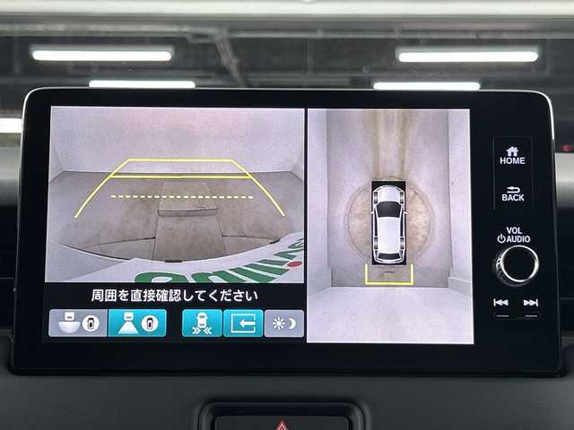 ホンダ ヴェゼル ハイブリッド e:HEV Z 愛知県 2024(令6)年 0.9万km プラチナホワイトパール 禁煙車/純正9インチナビ/（AM/FM/Bluetooth/フルセグTV/AppleCarPlay/AndroidAuto)/全方位カメラ/ワイヤレス充電/ホンダセンシング/・衝突軽減ブレーキ/・レーンキープアシスト/・オートマチックハイビーム/・追従式クルーズコントロール/・ブラインドスポットモニター/コーナーセンサー/ETC2.0/シートヒーター/パドルシフト/LEDヘッドライト/純正18インチアルミホイール/スマートキー/ブレーキホールド