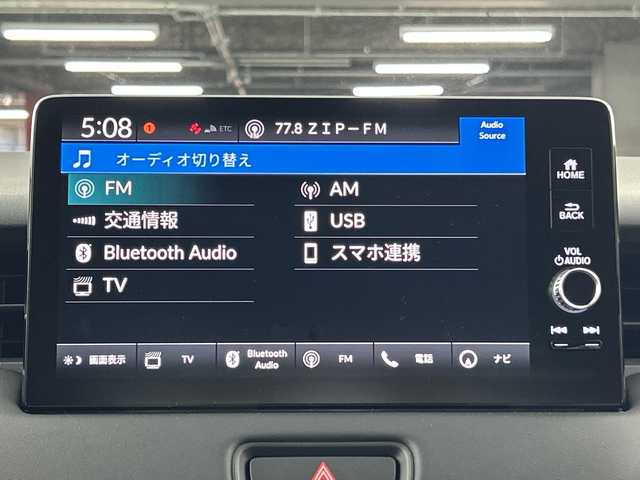 ホンダ ヴェゼル ハイブリッド e:HEV Z 愛知県 2024(令6)年 0.9万km プラチナホワイトパール 禁煙車/純正9インチナビ/（AM/FM/Bluetooth/フルセグTV/AppleCarPlay/AndroidAuto)/全方位カメラ/ワイヤレス充電/ホンダセンシング/・衝突軽減ブレーキ/・レーンキープアシスト/・オートマチックハイビーム/・追従式クルーズコントロール/・ブラインドスポットモニター/コーナーセンサー/ETC2.0/シートヒーター/パドルシフト/LEDヘッドライト/純正18インチアルミホイール/スマートキー/ブレーキホールド