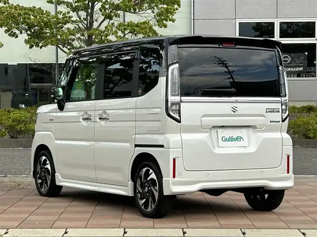 スズキ スペーシア カスタム HYBRID XS ターボ 福島県 2025(令7)年 0.1千km ピュアホワイトパール/ブラック2トーン スズキセーフティサポート/デュアルセンサーブレーキサポートII/アダプティブクルーズコントロール（ACC）/車線維持支援機能/車線逸脱抑制機能/車線逸脱警報機能/ふらつき警報機能/標識認識機能/ハイビームアシスト/発進お知らせ機能/ヘッドアップディスプレイ/誤発進抑制機能/後方誤発進抑制機能/スズキコネクト対応通信機装着車/純正ナビゲーション/【CD/DVD/USB/HDMI/BT/TV】/全方位モニター/ドライブレコーダー１２型デジタルミラー/型番：DVR-DM1246A-IC/フリップダウンモニター/ビルトインETC/両側電動スライドドア/前席シートヒーター/ステアリングヒーター/ステアリングリモコン/パドルシフト/シートバックテーブル/リアサーキュレーター/後席マルチユースフラップ/リアドアロールサンシェード/LEDオートライト/LEDフォグランプ/純正フロアマット/純正ドアバイザー