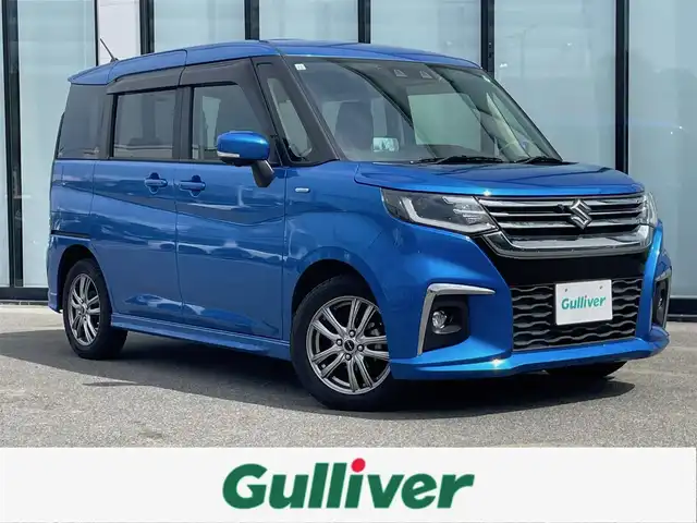 スズキ ソリオ HV MZ 大阪府 2021(令3)年 2.4万km スピーディーブルーM 全方位カメラ /パーキングアシスト /ETC /Bluetooth /追従走行型クルーズコントロール　/シートヒーター　/前後ドライブレコーダー　/純正フロアマット　/メモリーナビ　/純正ナビ　/フルセグテレビ　/プッシュスタート/両側パワースライドドア