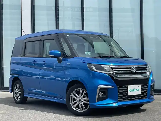 スズキ ソリオ HV MZ 大阪府 2021(令3)年 2.4万km スピーディーブルーM 全方位カメラ /パーキングアシスト /ETC /Bluetooth /追従走行型クルーズコントロール　/シートヒーター　/前後ドライブレコーダー　/純正フロアマット　/メモリーナビ　/純正ナビ　/フルセグテレビ　/プッシュスタート/両側パワースライドドア