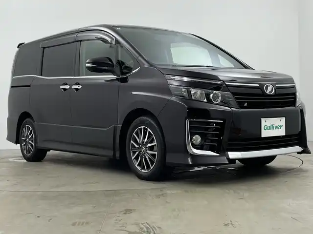 トヨタ ヴォクシー ZS 鹿児島県 2014(平26)年 6.2万km ボルドーマイカメタリック TRDエアロ/社外9インチSDナビ/（FM/AM/DVD/CD/フルセグテレビ/Bluetooth）/アルパイン製10.2インチフリップダウンモニター/ドライブレコーダー/両側パワースライドドア/純正16インチアルミホイール/バックカメラ/革巻きステアリング/アイドリングストップ/ステアリングスイッチ/LEDヘッドライト/オートライト/フォグランプ/純正フロアマット/ウィンカーミラー/ドアバイザー/プッシュスタート/スマートキー/ETC