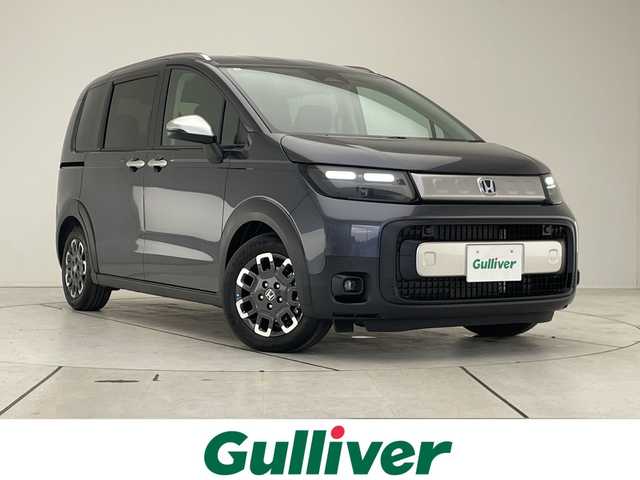 ホンダ フリード ハイブリット e:HEV クロスター 愛知県 2025(令7)年 0.1千km グレー 登録済未使用車/純正9型ディスプレイオーディオナビ/バックカメラ/両側パワースライドドア/シートヒーター/レーダークルーズコントロール/コーナーセンサー/純正アルミホイール/ルーフレール/LEDヘッドライト/衝突軽減システム/フルセグ/Bluetooth/ステアリングスイッチ/スマートキー/プッシュスタート