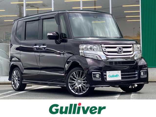 ホンダ Ｎ ＢＯＸ カスタム G ターボ Lパッケージ 静岡県 2015(平27)年 6万km プレミアムベルベットパープル・パール エンジンスタートボタン/保証書/取扱説明書/記録簿/パワーステアリング/パワーウィンドウ/パドルシフト/アイドリングストップ/ターボ/スマートキー/オートエアコン/スペアキー/クルーズコントロール/メモリナビ（CD/DVD/BT/ワンセグ）/ETC/バックカメラ/ドライブレコーダー/ベンチシート/純正フロアマット/ハーフレザーシート/両側パワースライドドア/RAYS16インチアルミホイール/ABS/横滑り防止装置/LEDヘッドライト/オートライト/社外LEDテールライト（純正車載）/Wプラスサイドエアバック/衝突軽減システム/カーテンエアバック