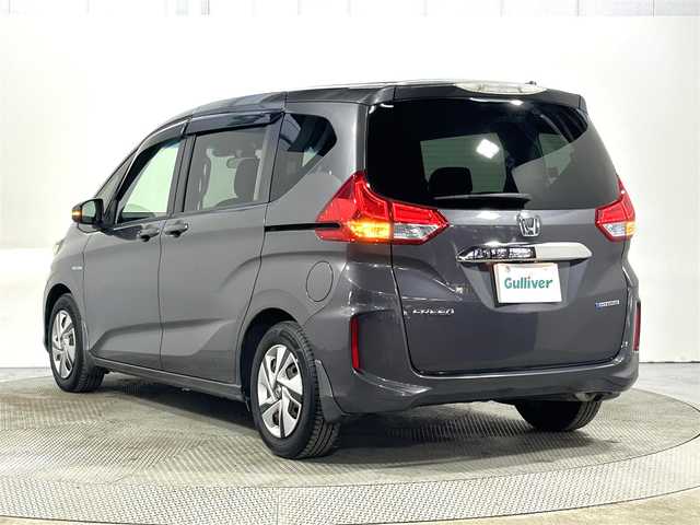 ホンダ フリード ハイブリット G ホンダセンシング 大阪府 2017(平29)年 1.7万km モダンスティールM 純正SDナビ（CD/DVD/Bluetooth）/フルセグTV/バックカメラ/衝突軽減システム/レーンアシスト/ドライブレコーダー/アイドリングストップ/クルーズコントロール/プッシュスタート/両側パワースライドドア/LEDヘッドライト/ETC