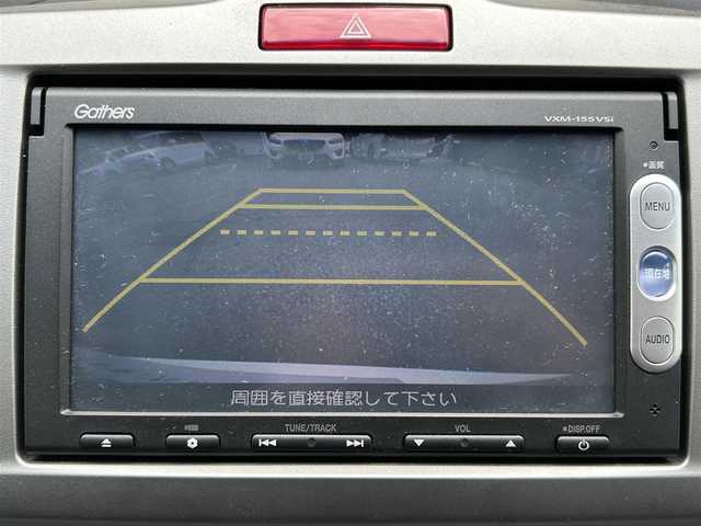 ホンダ フリード ハイブリット ジャストセレクション 大阪府 2014(平26)年 4.4万km ホワイトオーキッドパール 純正メモリナビ（VXM-207VFEi）/・ワンセグテレビ/・CD/DVD/・AM/FM/BT/バックカメラ/安全装備/・運転席用＆助手席用SRSエアバックシステム/・EBD（電子制御動力配分システム）付ABS/・VSA（ABS＋TCS＋横滑り制御）/・ヒルスタートアシスト/・ディスチャージヘッドライト＜HID＞/（ハイ/ロービーム、オートレベリング/オートライトコントロール機構付）/・クルーズコントロール/両側パワースライドドア/ETC/前後ドライブレコーダー（DRV-MR870）/革巻きステアリング/ステアリングスイッチ/取扱説明書/保証書/スペアキー1本
