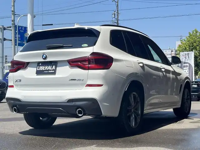 ＢＭＷ Ｘ３ xDrive20d Mスポーツ 岐阜県 2019(令1)年 2.7万km アルピンホワイトⅢ ドライビングアシストプラス/ACCアクティブクルーズ・コントロール（ストップ&ゴー機能付） /ステアリング&レーンコントロールアシスト /レーンディパーチャーウォーニング（車線逸脱警告システム） /レーン・チェンジウォーニング /アクティブ・サイドコリジョン・プロテクション /前車接近警告機能 /衝突回避被害軽減ブレーキ /事故回避アシスト /後車衝突警告機能 /クロストラフィックウォーニング（フロント&リヤ）　/パーキングアシストプラス/パーク・ディスタンス・コントロール （フロント&リヤ、ビジュアル表示機能付） /パーキング・アシスト（並列・縦列） /トップ・ビュー ー サイド・ビューカメラ ー リヤビュー・カメラ（予想進路表示機能付）　/地デジＴＶ　/ヘッドアップディスプレイ ヒートシーター /パワーシート　/純正ナビ　/電動リアゲート