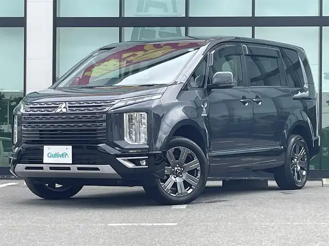 三菱 デリカＤ：５ ジャスパー 和歌山県 2023(令5)年 1.8万km グラファイトグレーメタリック/ブラックマイカ 純正10.14インチナビ/全方位カメラ/BT/CD/DVD/衝突軽減ブレーキ/レーンキープアシスト/レーダークルコン/ブラインドスポットモニター/オートライト/ETC/ドラレコ/両側パワスラ/シートヒーター/ステアリングヒーター/ステアリングリモコン/パドルシフト/パワーシート/オートホールド/純正18インチアルミ/レザー調シートカバー