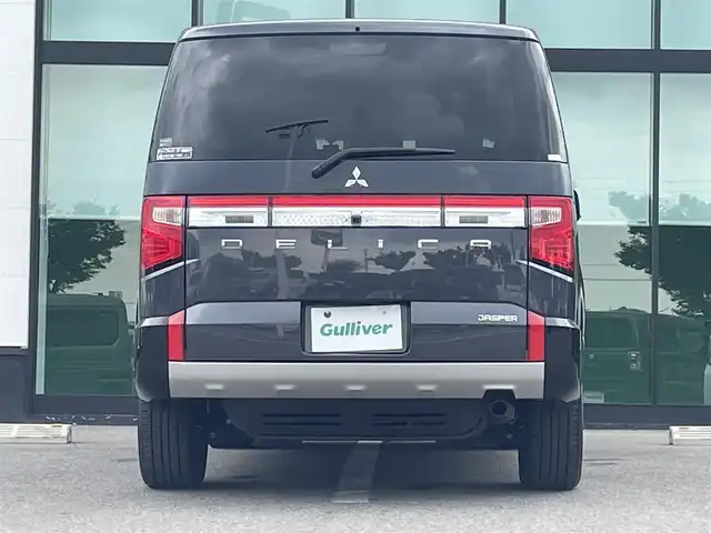 三菱 デリカＤ：５ ジャスパー 和歌山県 2023(令5)年 1.8万km グラファイトグレーメタリック/ブラックマイカ 純正10.14インチナビ/全方位カメラ/BT/CD/DVD/衝突軽減ブレーキ/レーンキープアシスト/レーダークルコン/ブラインドスポットモニター/オートライト/ETC/ドラレコ/両側パワスラ/シートヒーター/ステアリングヒーター/ステアリングリモコン/パドルシフト/パワーシート/オートホールド/純正18インチアルミ/レザー調シートカバー