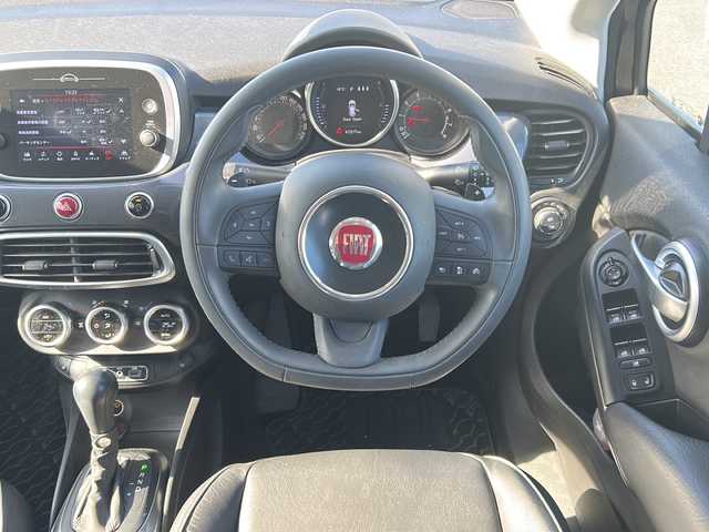 フィアット ５００Ｘ 佐賀県 2018(平30)年 4.2万km グレー エンジンスタートボタン/保証書/取扱説明書/記録簿/アイドリングストップ/スマートキー/スペアキー有/追従走行付きクルーズコントロール/Bluetooth接続/USB入力端子/ETC/バックカメラ/AUX/純正ナビ/前席パワーシート/前後コーナーセンサー/純正フロアマット/ABS/前後コーナーセンサー/レーンキープアシスト/盗難防止装置/オートライト/LEDライト/衝突被害軽減システム/クリアランスソナー/革巻ステアリング/ステアリングスイッチ/ブラインドスポットモニター/THULE/色コード:679ファッショングレー