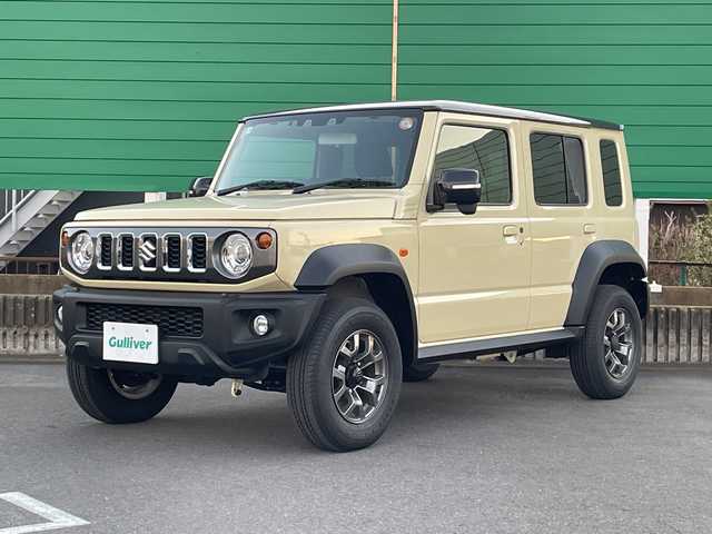 スズキ ジムニー ノマド FC 茨城県 2025(令7)年 0.3万km ベージュ ワンオーナー/セーフティーサポート/9型KEWOODナビ/ビルトインETC/バックカメラ/Bluetooth/フルセグTV/４WD/クリアランスソナー/アイドリングストップ/レーダークルーズコントロール/HDMI/シートヒーター/フロアマット/背面タイヤ/横滑り防止装置/レーンキープアシスト/オートライト/LEDヘッドライト/コーナーセンサー後方/衝突軽減システム/社外テール（純正テール積み込み）