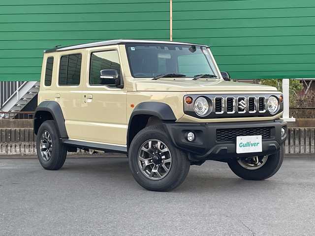 スズキ ジムニー ノマド FC 茨城県 2025(令7)年 0.3万km ベージュ ワンオーナー/セーフティーサポート/9型KEWOODナビ/ビルトインETC/バックカメラ/Bluetooth/フルセグTV/４WD/クリアランスソナー/アイドリングストップ/レーダークルーズコントロール/HDMI/シートヒーター/フロアマット/背面タイヤ/横滑り防止装置/レーンキープアシスト/オートライト/LEDヘッドライト/コーナーセンサー後方/衝突軽減システム/社外テール（純正テール積み込み）