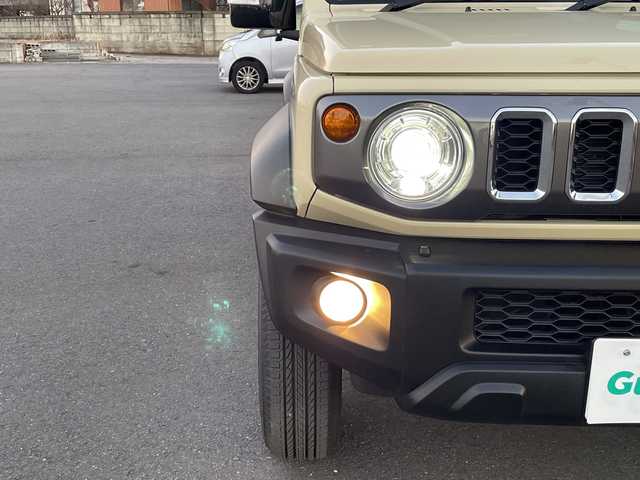 スズキ ジムニー ノマド FC 茨城県 2025(令7)年 0.3万km ベージュ ワンオーナー/セーフティーサポート/9型KEWOODナビ/ビルトインETC/バックカメラ/Bluetooth/フルセグTV/４WD/クリアランスソナー/アイドリングストップ/レーダークルーズコントロール/HDMI/シートヒーター/フロアマット/背面タイヤ/横滑り防止装置/レーンキープアシスト/オートライト/LEDヘッドライト/コーナーセンサー後方/衝突軽減システム/社外テール（純正テール積み込み）
