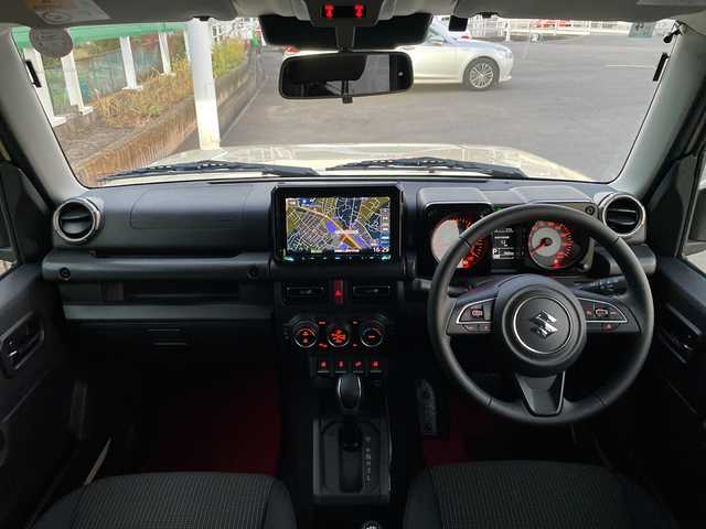 スズキ ジムニー ノマド FC 茨城県 2025(令7)年 0.3万km ベージュ ワンオーナー/セーフティーサポート/9型KEWOODナビ/ビルトインETC/バックカメラ/Bluetooth/フルセグTV/４WD/クリアランスソナー/アイドリングストップ/レーダークルーズコントロール/HDMI/シートヒーター/フロアマット/背面タイヤ/横滑り防止装置/レーンキープアシスト/オートライト/LEDヘッドライト/コーナーセンサー後方/衝突軽減システム/社外テール（純正テール積み込み）