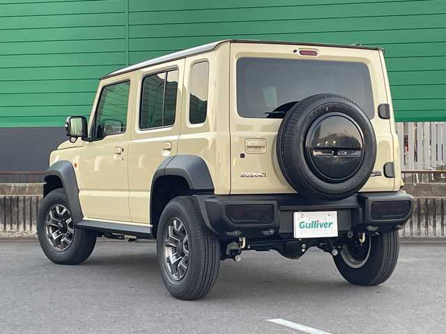 スズキ ジムニー ノマド FC 茨城県 2025(令7)年 0.3万km ベージュ ワンオーナー/セーフティーサポート/9型KEWOODナビ/ビルトインETC/バックカメラ/Bluetooth/フルセグTV/４WD/クリアランスソナー/アイドリングストップ/レーダークルーズコントロール/HDMI/シートヒーター/フロアマット/背面タイヤ/横滑り防止装置/レーンキープアシスト/オートライト/LEDヘッドライト/コーナーセンサー後方/衝突軽減システム/社外テール（純正テール積み込み）
