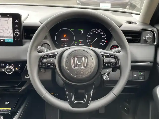 ホンダ ヴェゼル ハイブリッド e:HEV Z 東京都 2025(令7)年 0.1千km クリスタルブラックパール 登録済未使用車　/純正９型ホンダコネクトナビ　/置型充電　/電動リアゲート/ＥＴＣ２．０　/ＢＳＭ　/フルセグＴＶ　/シートヒーター　/ハンドルヒーター　/追従クルコン　/パドルシフト　/ＬＥＤヘッド　/純正１８インチＡＷ