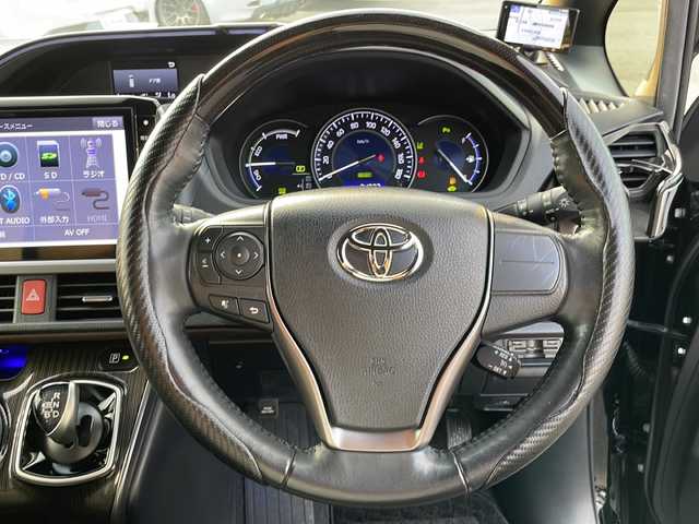 トヨタ エスクァイア ハイブリッド Gi プレミアムパッケージ 山口県 2020(令2)年 7.5万km ブラック Toyota Safety Sense C/(衝突回避支援/レーンディパーチャーアラート/オートマチックハイビーム)/フロントエアロ（TRD　SPORTIRO）/社外１１インチメモリナビ(アルパイン　EX11Z-EQ)/（AM/FM/CD/DVD/BT/フルセグ）/バックカメラ/両側電動スライドドア/クルーズコントロール/LEDオートライト/ハーフレザーシート/シートヒーター/１７インチアルミホイール/ドライブレコーダー　（AG421-DRC）/スマートキー/ビルトインETC