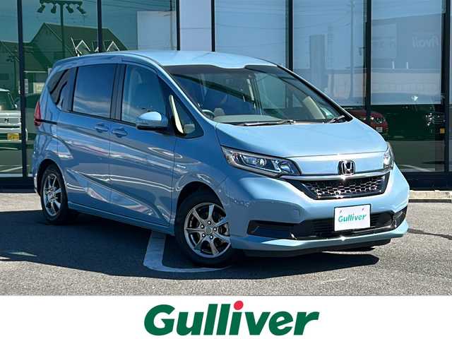 ホンダ フリード ハイブリット G ホンダセンシング 岐阜県 2019(令1)年 2.7万km シーグラスブルーパール 登録時走行距離26919km/純正ナビ/フルセグＴＶ/バックモニター/両側パワースライドドア/ラジアルタイヤ（４本)/クルーズコントロール/レーンキープアシスト/シートヒーター/純正フロアマット/前後ドライブレコーダー/禁煙車/プッシュスタート/スマートキー/後席サンシェード/衝突被害軽減システム/LEDヘッドライト/オートライト/社外15インチアルミホイール/CDチェンジャー/Bluetooth接続/USB入力端子/ETC