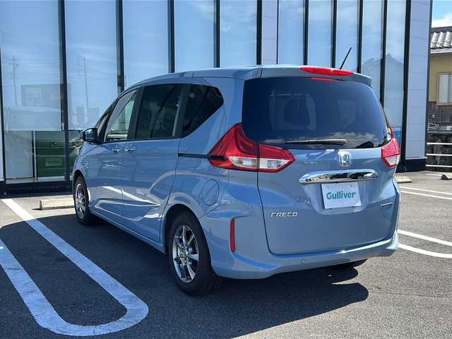 ホンダ フリード ハイブリット G ホンダセンシング 岐阜県 2019(令1)年 2.7万km シーグラスブルーパール 登録時走行距離26919km/純正ナビ/フルセグＴＶ/バックモニター/両側パワースライドドア/ラジアルタイヤ（４本)/クルーズコントロール/レーンキープアシスト/シートヒーター/純正フロアマット/前後ドライブレコーダー/禁煙車/プッシュスタート/スマートキー/後席サンシェード/衝突被害軽減システム/LEDヘッドライト/オートライト/社外15インチアルミホイール/CDチェンジャー/Bluetooth接続/USB入力端子/ETC
