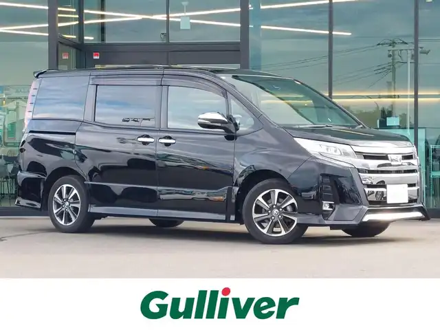 トヨタ ノア Si ダブルバイビーⅢ 東京都 2021(令3)年 2.4万km ブラック 純正9インチナビ（フルセグ/Bluetooth/CD/AM/FM/SD）/トヨタセーフティセンス/レーダークルーズコントロール/レーンキープアシスト/両側パワースライドドア/バックカメラ/ビルトインETC/デュアルオートアエコン/アイドリングストップ/オートハイビーム