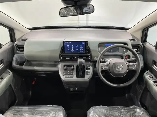 ホンダ フリード ハイブリット e:HEV クロスター 愛知県 2025(令7)年 0.1千km クリスタルブラックパール 登録済未使用車　/純正９インチナビ　/(FM/AM/フルセグTV/AppleCarPlay/AndroidAuto/Bluetooth)/ホンダセンシング　/　　-衝突軽減ブレーキ　/　　-誤発進抑制機能/　　-路線逸脱抑制機能/　　-アダプティブクルーズコントロール/　　-先行車発進お知らせ機能/　　-標識認識機能/　　-オートハイビーム/両側パワースライドドア　/シートヒーター　/ＬＥＤヘッドライト　/LEDフォグランプ/バックカメラ　/コーナーセンサー　/ブラインドスポットモニター　/ＵＳＢ接続　/アクセサリーソケット/ISOFIX/プッシュスタート/　　-スマートキー/電動パーキングブレーキ