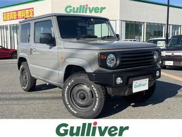 スズキ ジムニー XL 鳥取県 2022(令4)年 1.4万km ミディアムグレー ４・W・D・ターボ/ワンオーナー/社外DPオーディオ/DVD/CD/BT/USB/API0コンプリートカーTSシリーズ/API0フロントバンパー/API0フロントグリル/API016インチアルミ/API0背面タイヤカバー/TOYOオープンカントリータイヤ/レーダーブレーキサポート/前後ドライブレコーダー/前席シートヒーター/LEDヘットライト/オートハイビーム/プッシュエンジンスタート/アイドリングストップ/スペアキー