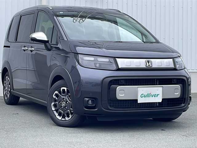 ホンダ フリード ハイブリット e:HEV クロスター 三重県 2025(令7)年 0.1千km メテオロイドグレーメタリック 純正９インチコネクトナビ/アップルカープレイ/ＢＳＭ/両側パワースライドドア/バックカメラ/前席シートヒーター/追従クルーズコントロール/コーナーセンサー/ＵＳＢ給電/ＬＥD/ハーフレザーシート/ステアリングリモコン/禁煙車
