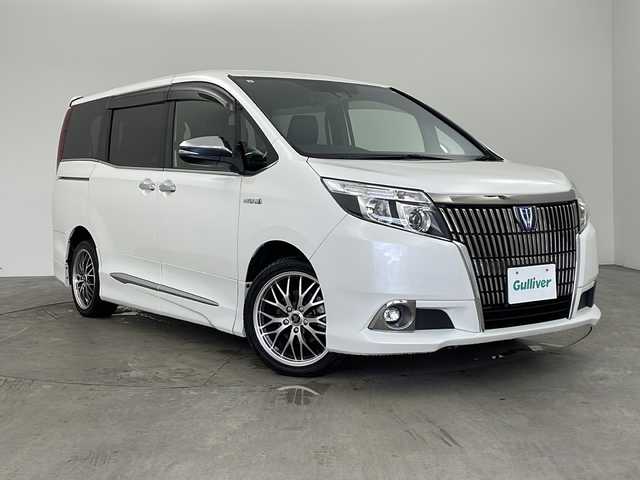 トヨタ エスクァイア ハイブリッド Gi プレミアムパッケージ ブラックテーラード 兵庫県 2017(平29)年 6万km ホワイトパールクリスタルシャイン ・ワンオーナー/・純正ナビ/CD/DVD/BT/USB/SD/TV/・バックカメラ/・トヨタセーフティセンス/・プリクラッシュセーフティ/・レーンディパーチャーアラート/・先行車発進告知/・オートマチックハイビーム/・クルーズコントロール/・トラクションコントロール/・両側パワースライドドア/・前席シートヒーター/・レザーシート/・WAC/・ステアリングリモコン/・LEDヘッドライト/・オートライト/・フォグランプ/・ウォークスルー/・サンシェード/・純正フロアマット/・オールオートパワーウィンドウ/・電動格納ミラー/・スマートキー/・スペアキー/・プッシュスタート