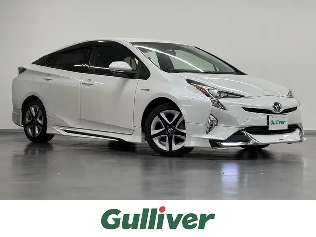 トヨタ プリウス S ツーリングセレクション 三重県 2017(平29)年 2.2万km ホワイトパールクリスタルシャイン ハイブリッド/FF/インパネCVT/純正 7インチナビ NSCD-W66/（AM/FM/CD/SD/地デジTV/AUX/Bluetooth）/バックカメラ/モデリスタエアロ（F/S/R下）/ビルトイン ETC/安全/・横滑り防止機能/・SRS サイド＆カーテンシールドエアバッグ/装備/・合皮シート（ブラック）/・快適温熱シート（D/N）/・オートライト/・LEDヘッドランプ/・【OP】LEDフロントフォグライト（アクセサリーランプ［薄暮灯］付）/・【OP】ナビレディセット（バックカメラ、ステアリングスイッチ）/・オートエアコン/・自動防眩インナーミラー/・純正17inAW/・プッシュスタート/・スマートキーx2/・保/など