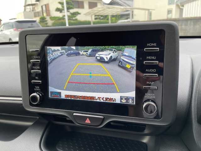 トヨタ ヤリス ハイブリッド X 大阪府 2021(令3)年 2.2万km スーパーホワイトⅡ 純正8インチディスプレイオーディオ（ナビ有/Bluetooth/USB）/4WD/バックカメラ/横滑り防止装置/レーンキープアシスト/衝突被害軽減システム/レーダークルーズコントロール/ドライブレコーダー（CS-21FH)/ステアリングスイッチ/スマートキー/スペアキー1本/取扱説明書