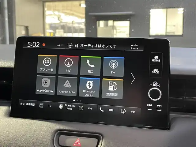 ホンダ ヴェゼル ハイブリッド e:HEV Z 滋賀県 2025(令7)年 0.1千km クリスタルブラックパール 純正9インチナビ/【Bluetooth/USB/Apple CarPlay/Android Auto】/バックカメラ/ハーフレザーシート/ホンダセンシング/・衝突軽減ブレーキ（CMBS）/・先行車発進お知らせ機能/・歩行者事故低減ステアリング/・路外逸脱抑制機能/・標識認識機能/・渋滞追従機能付アダプティブクルーズコントロール/・車線維持支援システム（LKAS）/・トラフィックジャムアシスト（渋滞運転支援機能）/・ブラインドスポットインフォメーション/・誤発進抑制機能/・後方誤発進抑制機能/・近距離衝突軽減ブレーキ/・急アクセル抑制機能/・パーキングセンサーシステム/・後退出庫サポート/・オートハイビーム/・アダプティブドライビングビーム/LEDヘッドライト/クリアランスソナー/シートヒーター/ステアリングヒーター/ヒルディセントコントロール/ワイヤレス充電/ビルトインETC2.0/衝突軽減ブレーキ/パワーバックドア/電動パーキングブレーキ/オートブレーキホールド/純正フロアマット