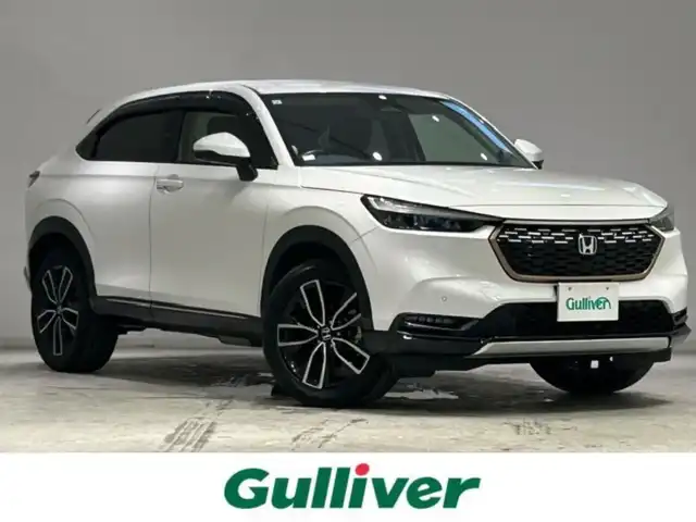 ホンダ ヴェゼル ハイブリッド 宮城県 2021(令3)年 6.4万km プラチナホワイトパール Ｈｏｎｄａ　ＳＥＮＳＩＮＧ/・衝突軽減ブレーキ/・誤発進抑制機能/・アダプティブクルーズコントロール/・オートハイビーム/・パーキングセンサーシステム/・後退出庫サポート/・ブラインドスポットインフォメーション/・Honda CONNECTディスプレー/・マルチビューカメラシステム/純正ＳＤナビ/Ｂｌｕｅｔｏｏｔｈ/全方位車外カメラ/純正ビルドインＥＴＣ２．０/フルセグＴＶ（キャンセラー付き）/パドルシフト/ワイヤレス充電器/純正18インチアルミホイール/シートヒーター/パワーシート/アイドリングストップ/プッシュスタート/ウィンカーミラー/プッシュスタート/電動リアゲート