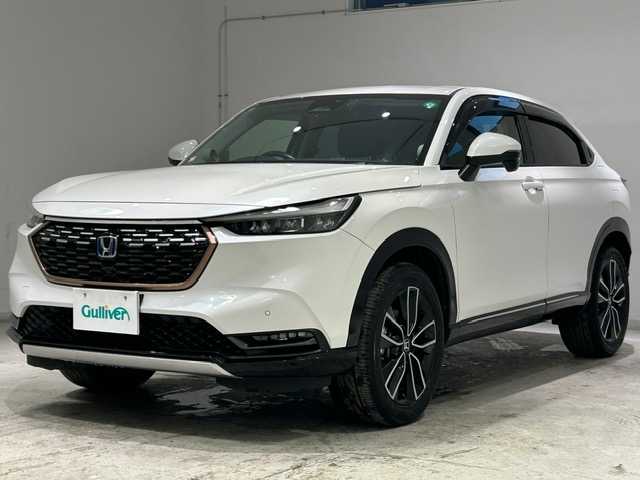 ホンダ ヴェゼル ハイブリッド 宮城県 2021(令3)年 6.4万km プラチナホワイトパール Ｈｏｎｄａ　ＳＥＮＳＩＮＧ/・衝突軽減ブレーキ/・誤発進抑制機能/・アダプティブクルーズコントロール/・オートハイビーム/・パーキングセンサーシステム/・後退出庫サポート/・ブラインドスポットインフォメーション/・Honda CONNECTディスプレー/・マルチビューカメラシステム/純正ＳＤナビ/Ｂｌｕｅｔｏｏｔｈ/全方位車外カメラ/純正ビルドインＥＴＣ２．０/フルセグＴＶ（キャンセラー付き）/パドルシフト/ワイヤレス充電器/純正18インチアルミホイール/シートヒーター/パワーシート/アイドリングストップ/プッシュスタート/ウィンカーミラー/プッシュスタート/電動リアゲート